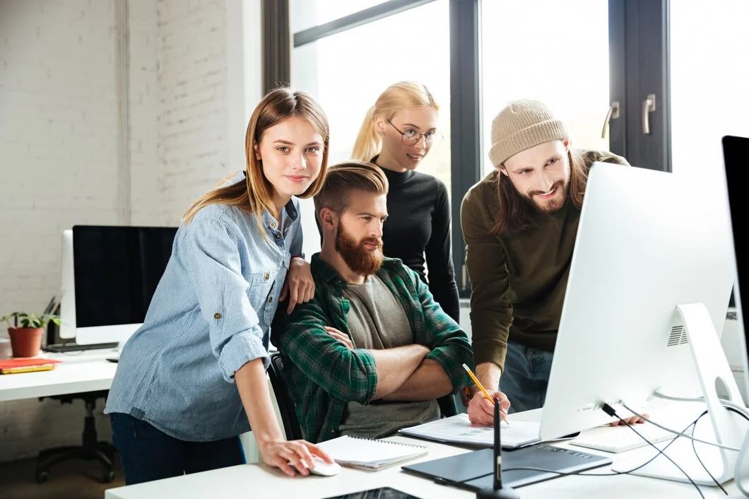 colleagues-office-talking-with-each-other-using-computer_171337-6849 image 3-1